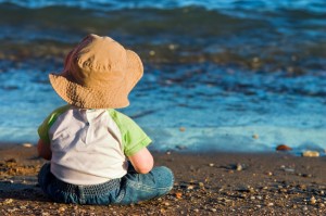 Child sitting on a beach contemplating life :)